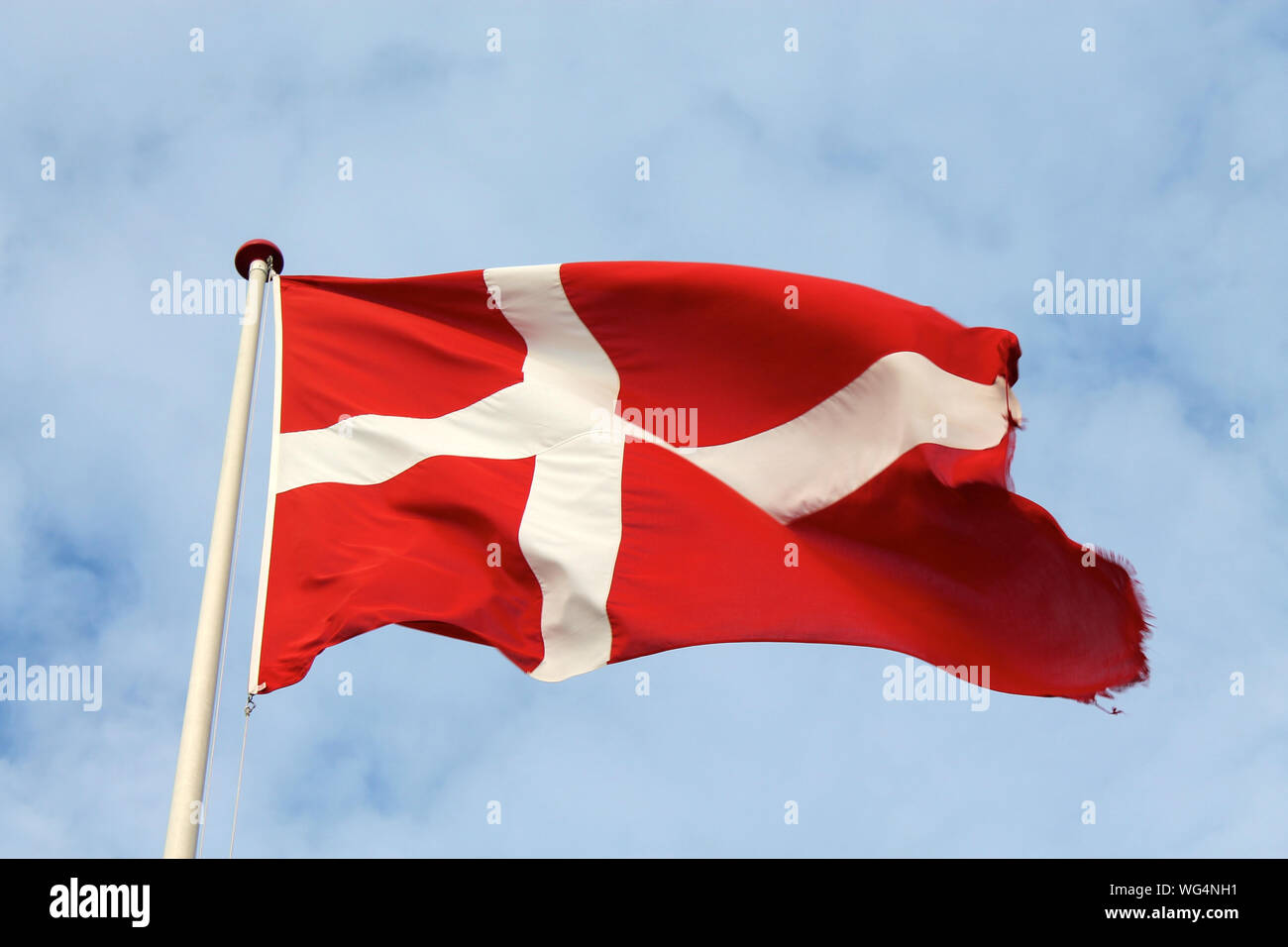 Low Angle View Of Danish Flag Against Sky Stock Photo