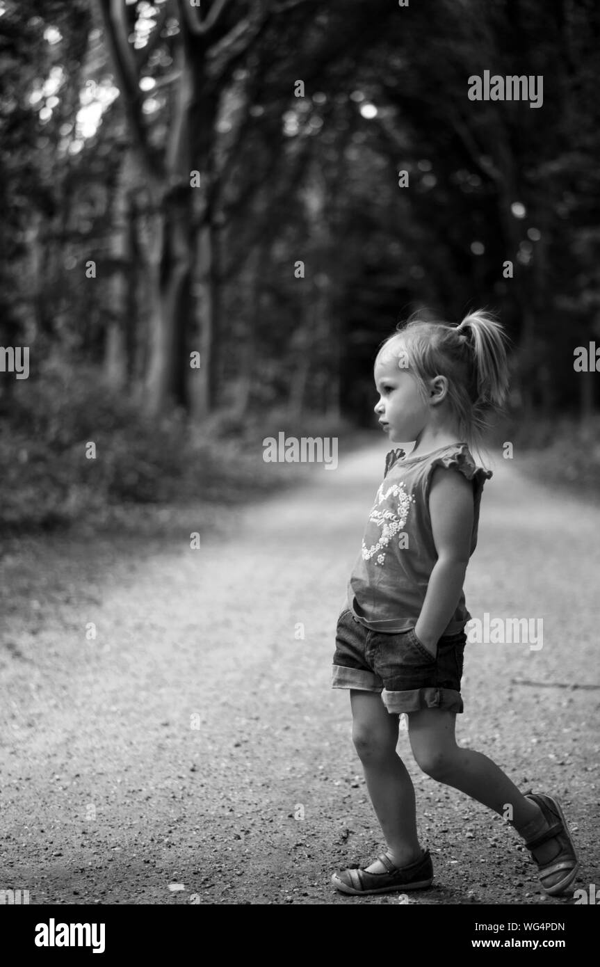 Girl walking on pathway Black and White Stock Photos & Images Alamy