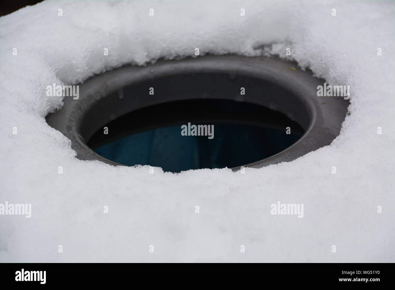 Close-up Of Ice Fishing Hole Stock Photo