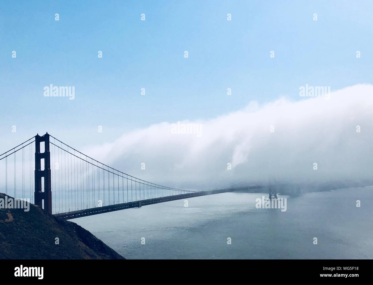 View Of Suspension Bridge In Foggy Weather Stock Photo Alamy