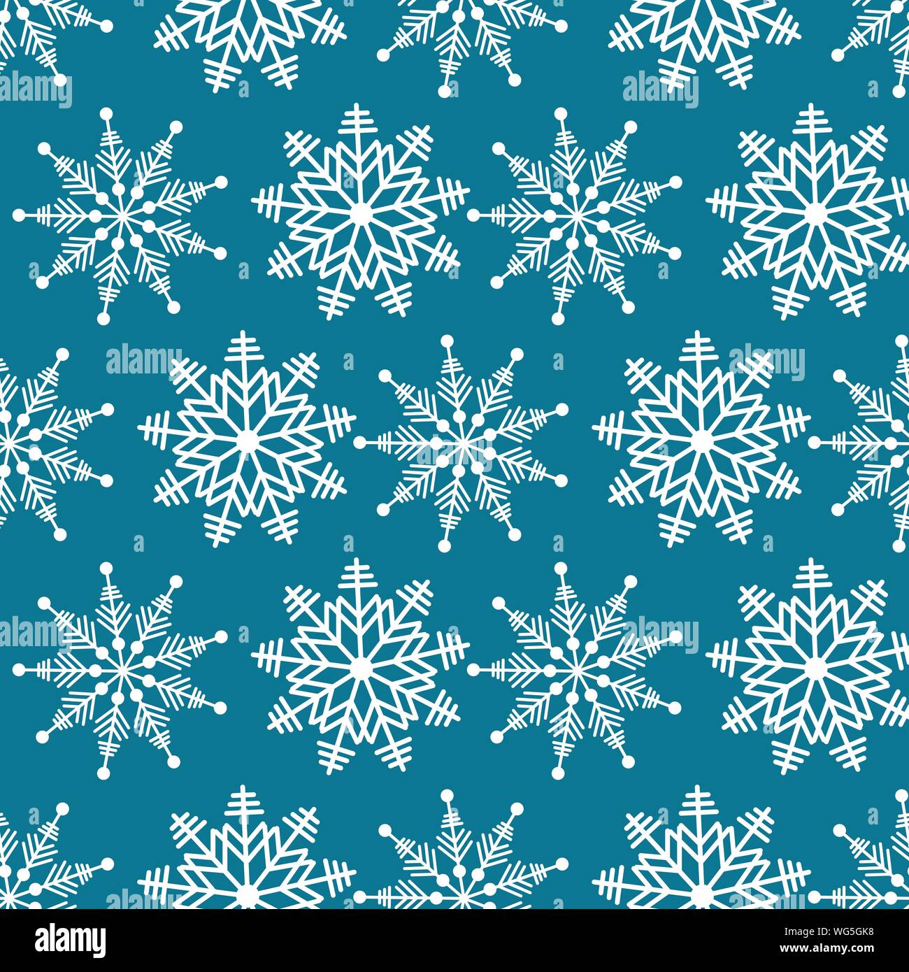 Winter wonderland delicate white snowflake crystal on a teal blue ...