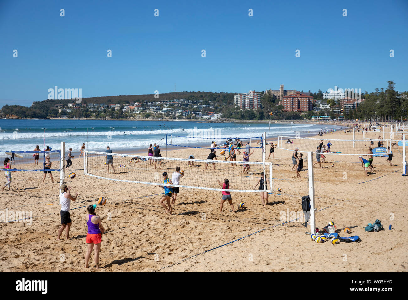 People playing beach volleyball on Mnaly beach in Sydney northern beaches,Australia Stock Photo