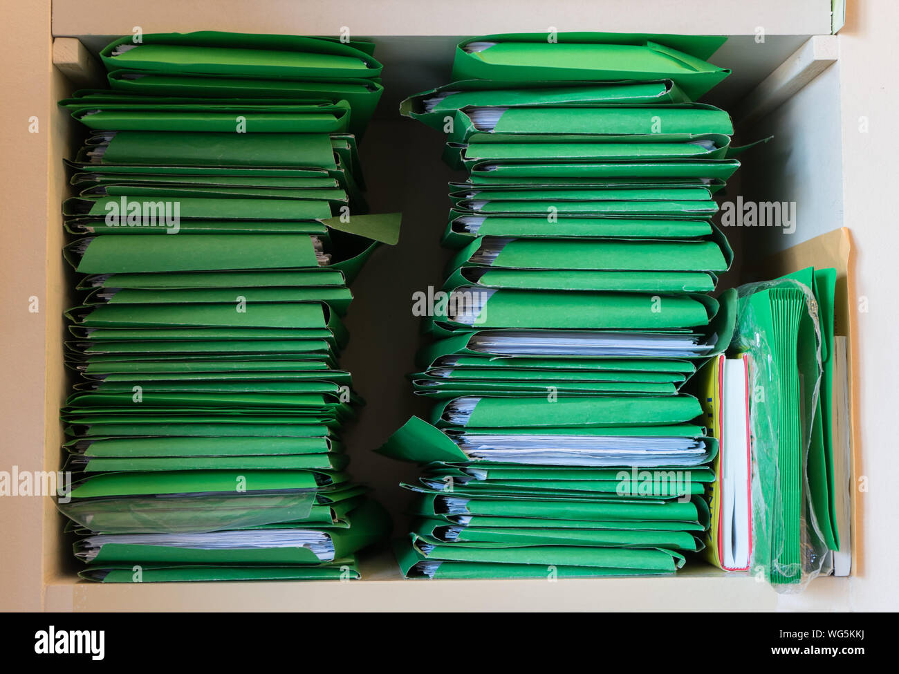 numerous office practices and work documents waiting to be processed. concept of stressful and excessive backlog Stock Photo