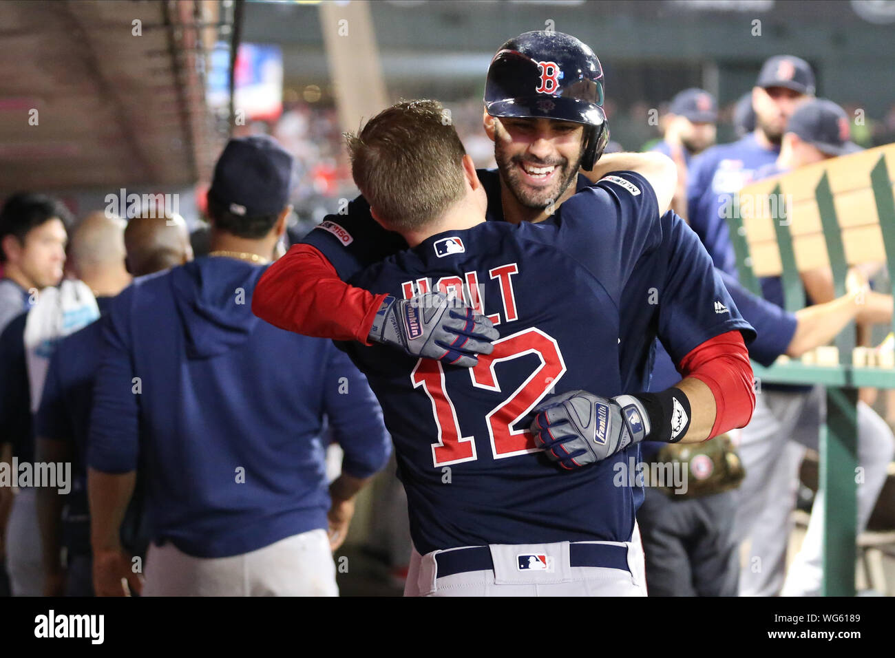 August 30, 2019: Boston Red Sox left fielder J.D. Martinez (28) gets a big hug from Boston Red Sox second baseman Brock Holt (12) following his homer during the game between the Boston Red Sox and the Los Angeles Angels of Anaheim at Angel Stadium in Anaheim, CA, (Photo by Peter Joneleit, Cal Sport Media) Stock Photo