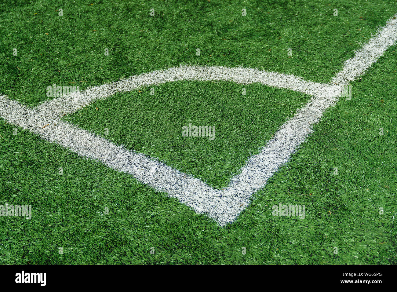Photo of the details of football field with artificial grass Stock