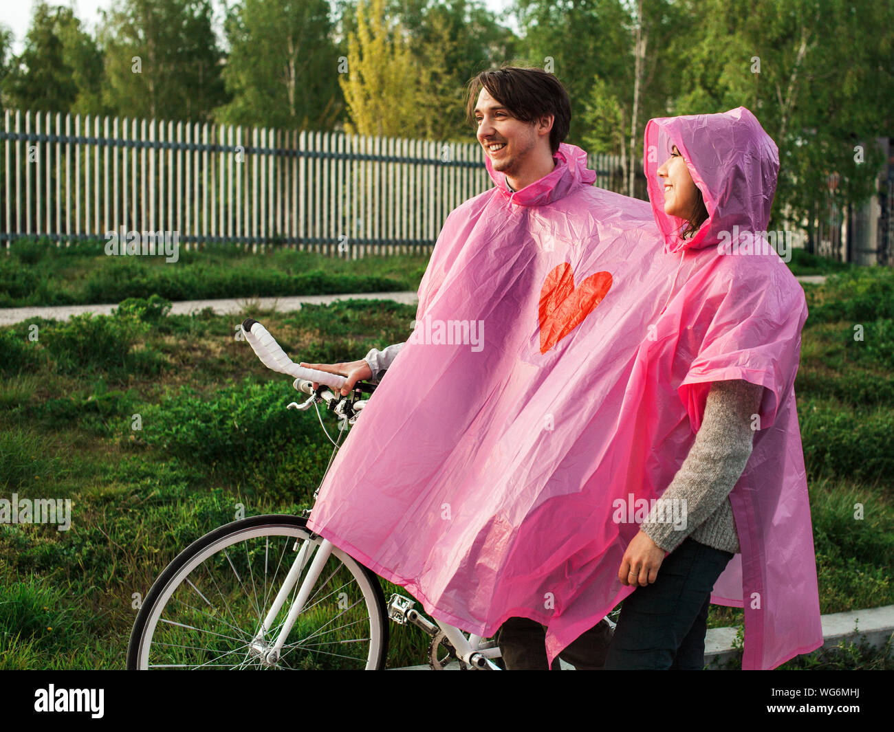 Pink raincoat hi-res stock photography and images - Alamy