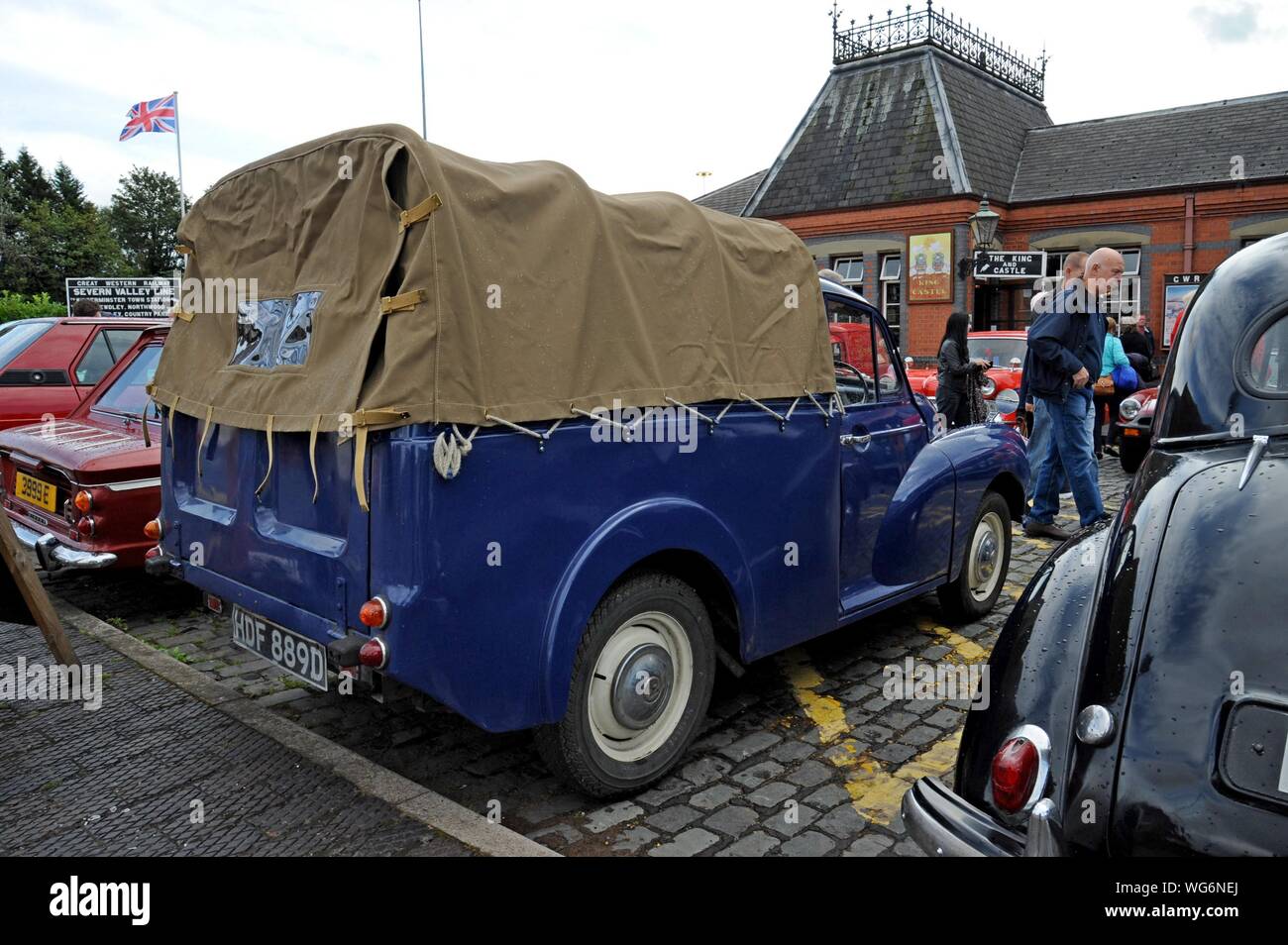 A restored 1966 Morris Minor pick up in a classic car display at the