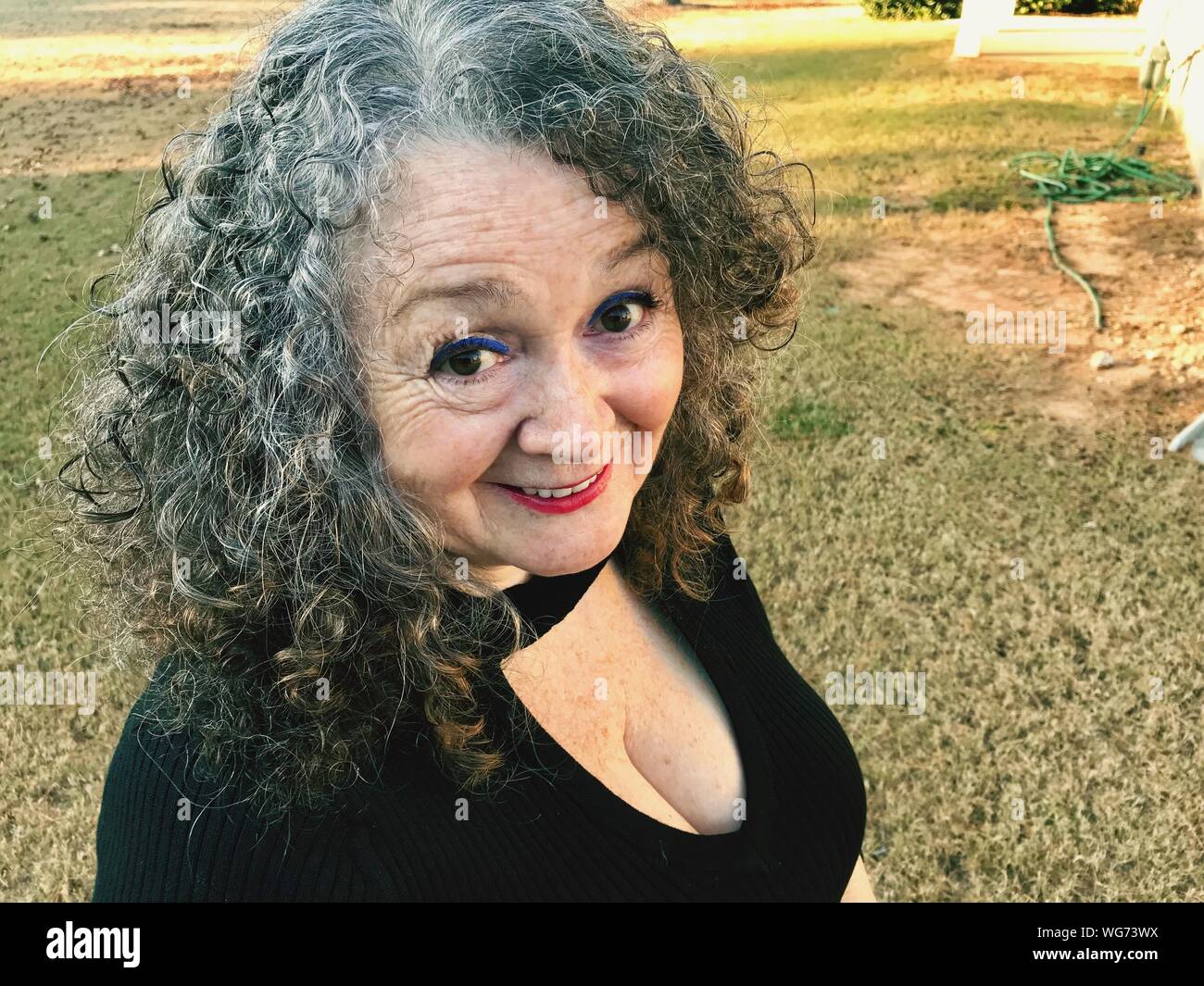 Mature woman curly hair High Resolution Stock Photography and Images ...