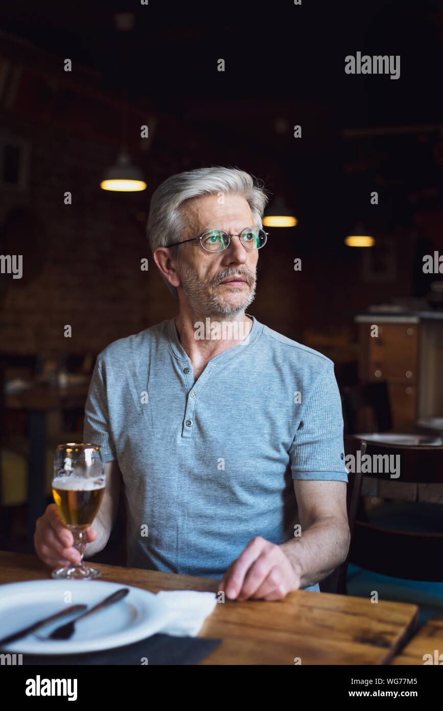 Old man drinking beer hi-res stock photography and images - Alamy