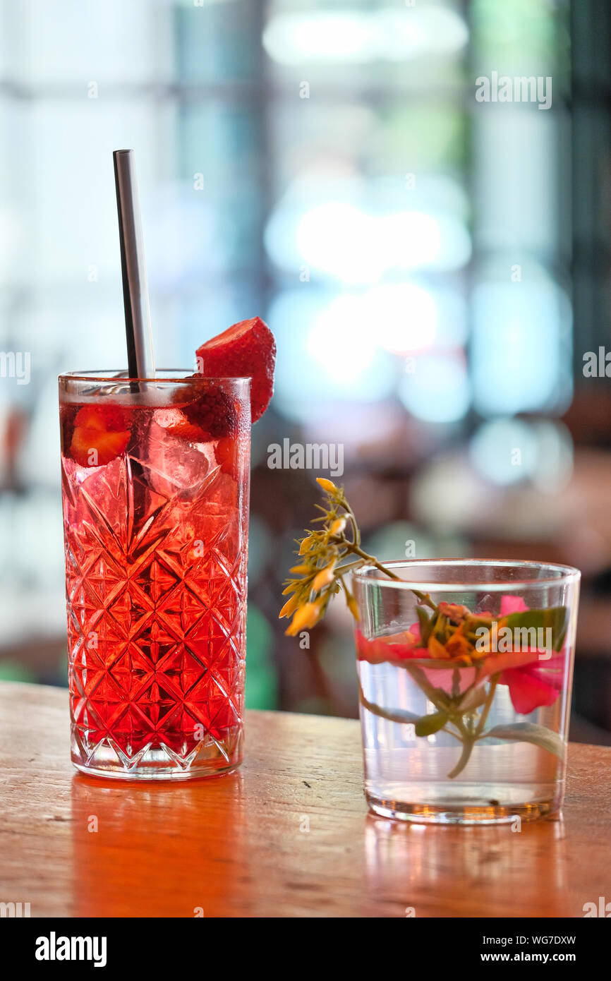 Red and Pink Fresh Colorful Exotic Alcoholic Cocktail with Blackberry on the Wooden Table. Red and Pink Mojito Stock Photo