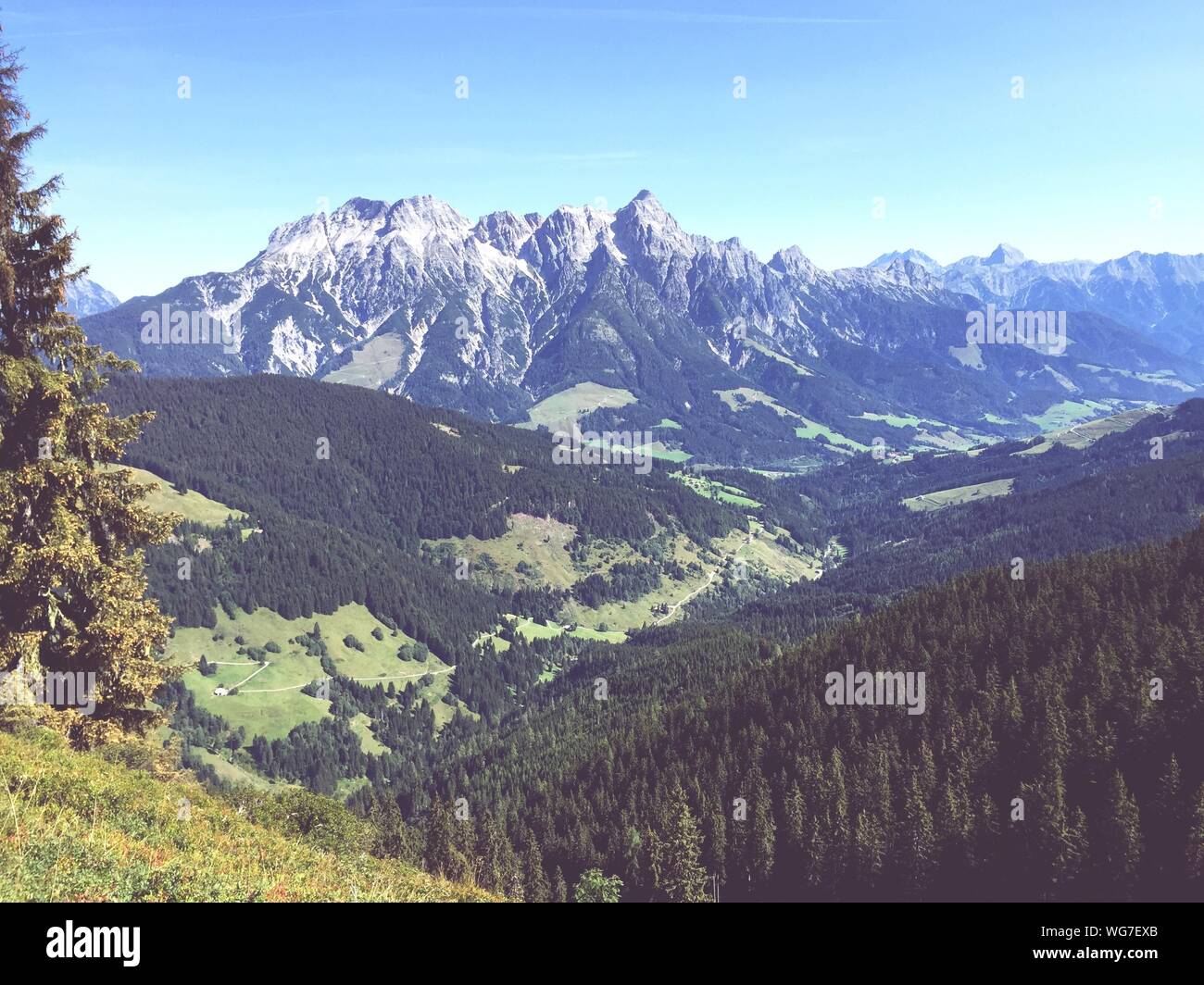 Scenic View Of Mountains Against Sky On Sunny Day At Saalbach-hinterglemm Stock Photo