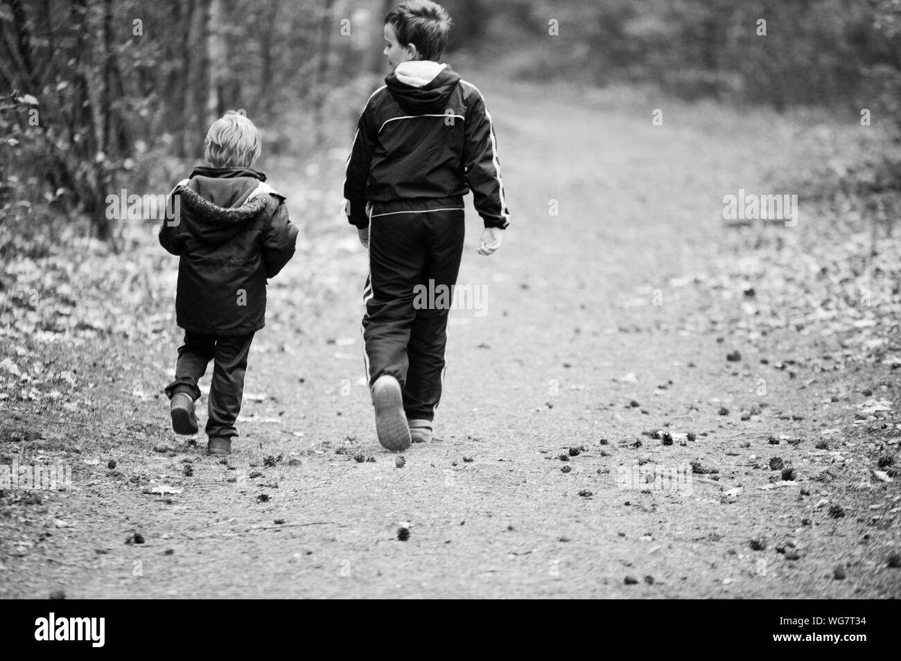 Two boys in forest Black and White Stock Photos & Images - Alamy