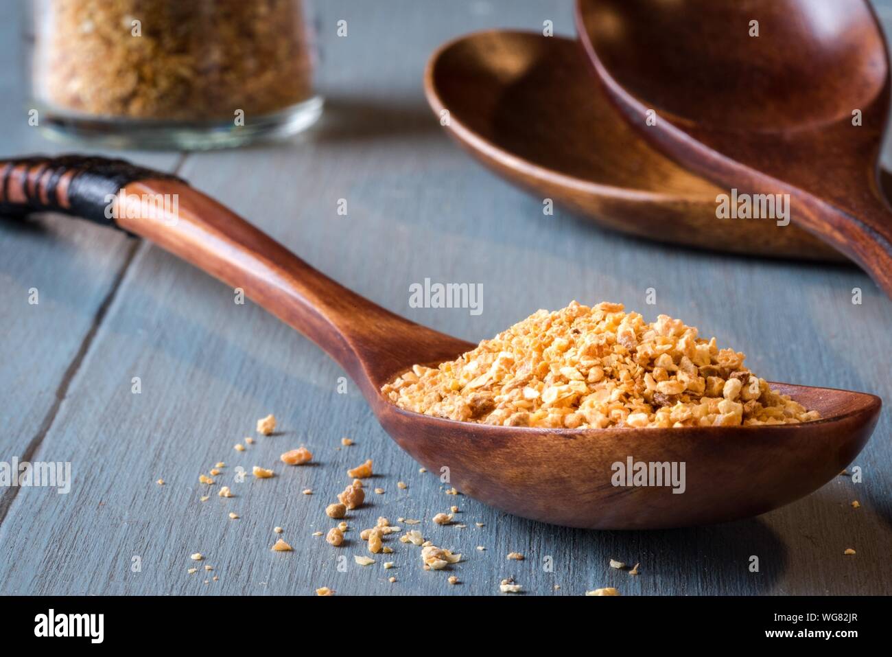 Close-up Of Dried Orange Peel In Wooden Spoon On Table Stock Photo