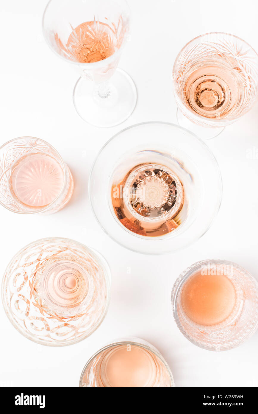 Sparkling rose wine in different glasses on white background Stock ...