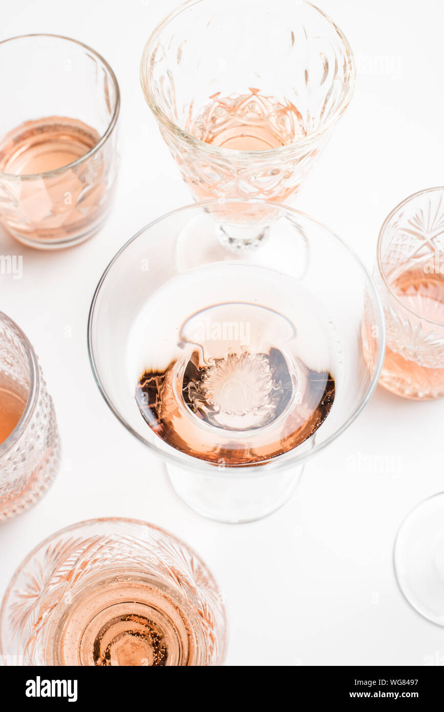 Sparkling rose wine in different glasses on white background Stock ...
