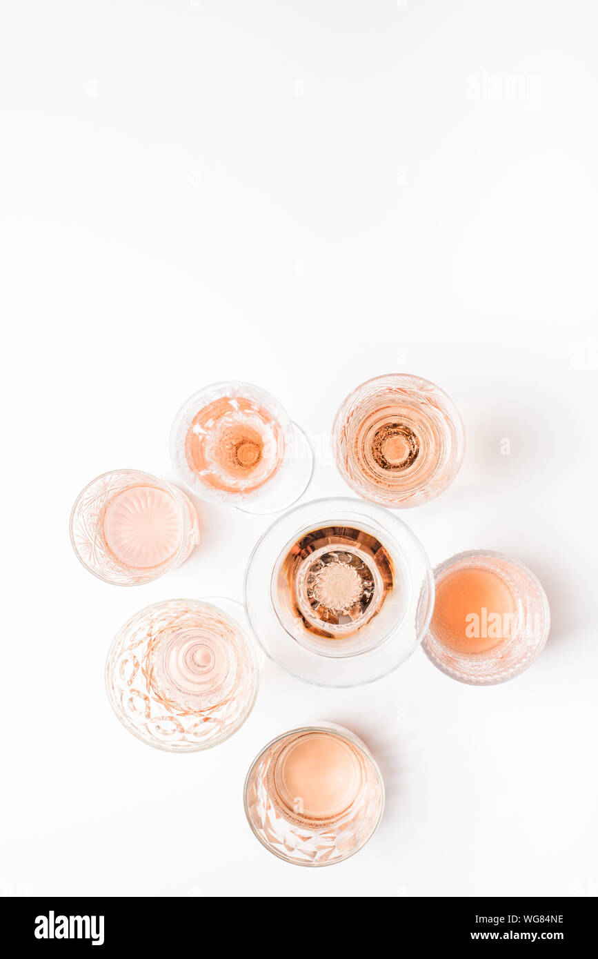 Sparkling rose wine in different glasses on white background Stock ...