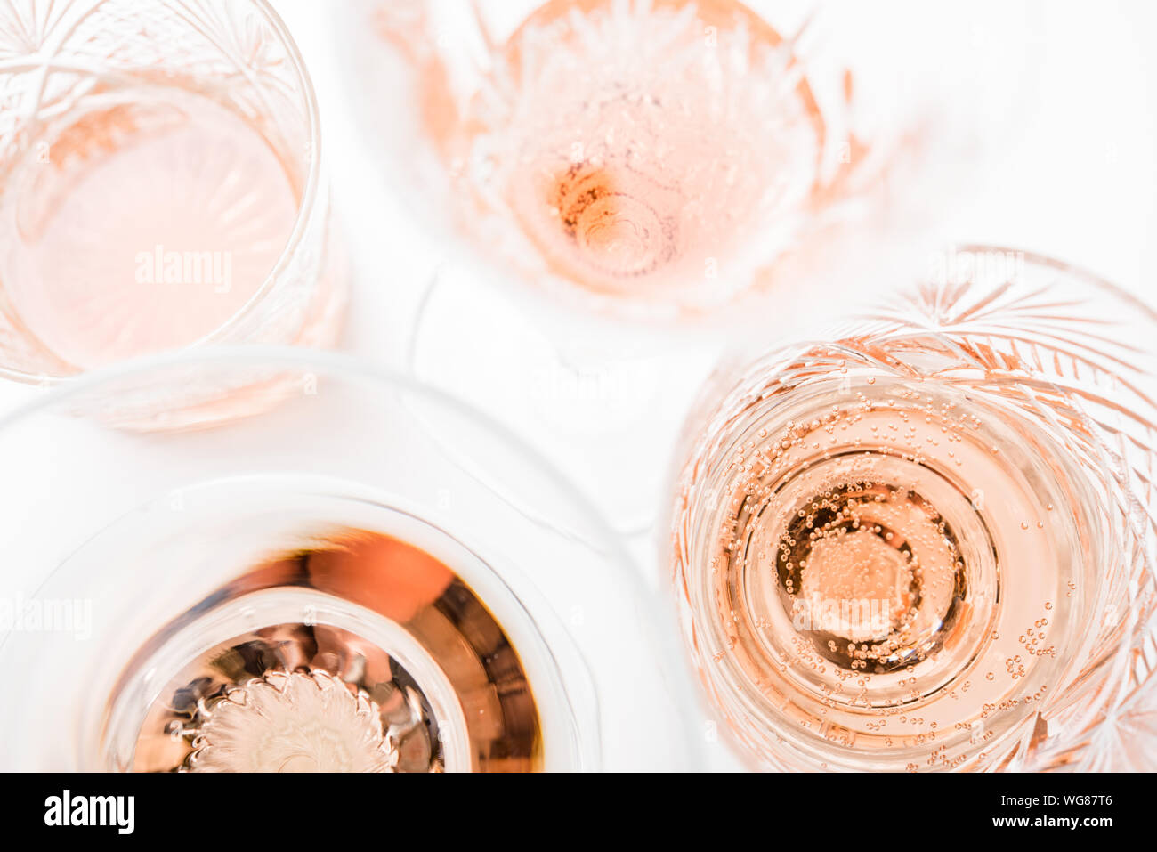 Sparkling rose wine in different glasses on white background Stock ...