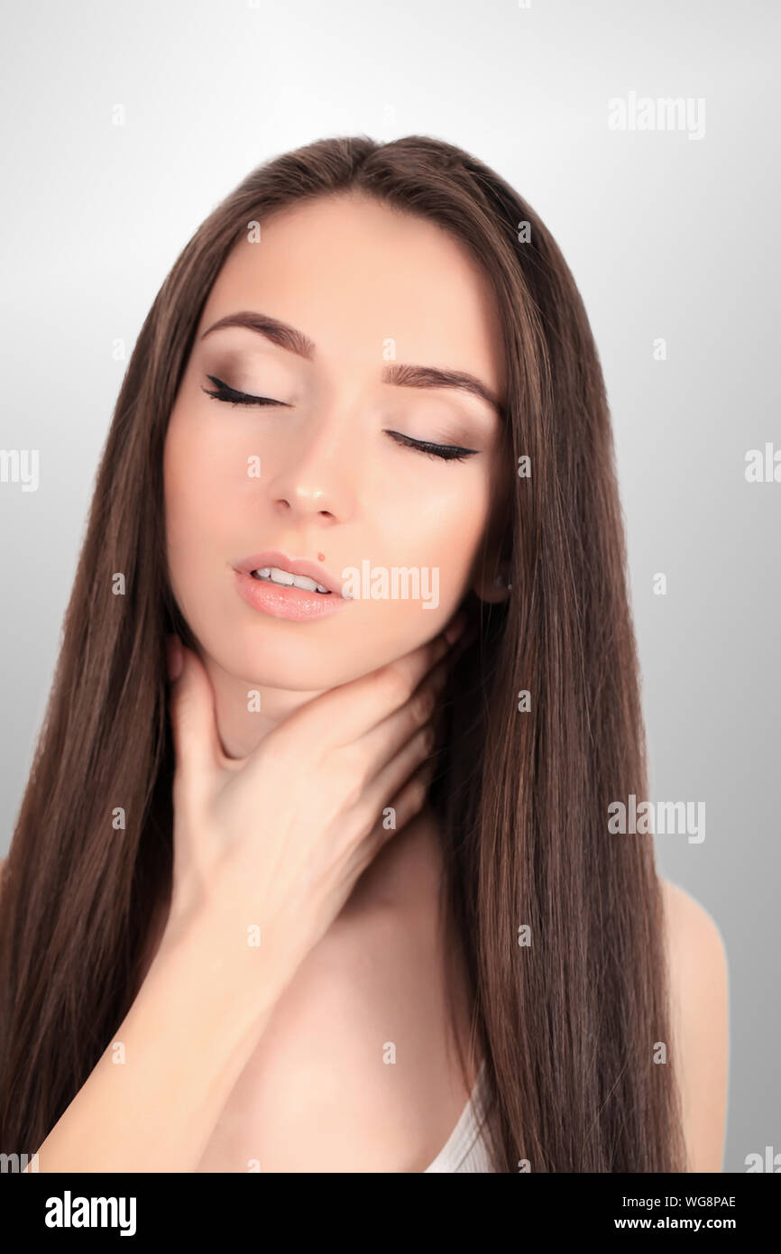 Tired Neck. Beautiful Young Woman Suffering From Neck Pain. Attractive