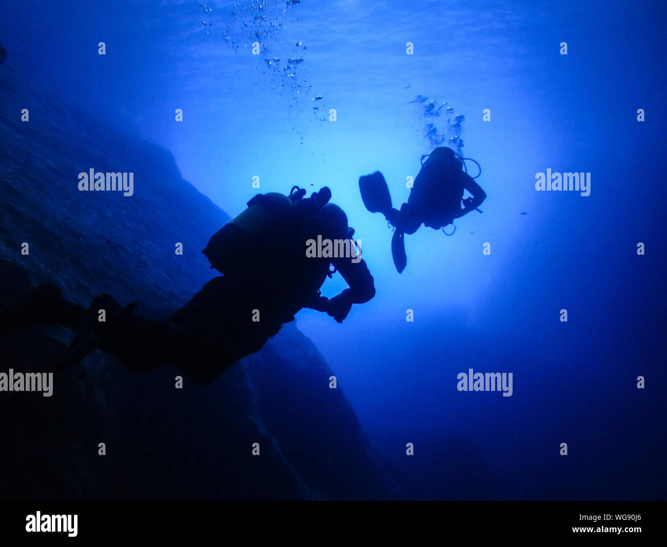 Silhouette scuba diver swimming in hi-res stock photography and images ...