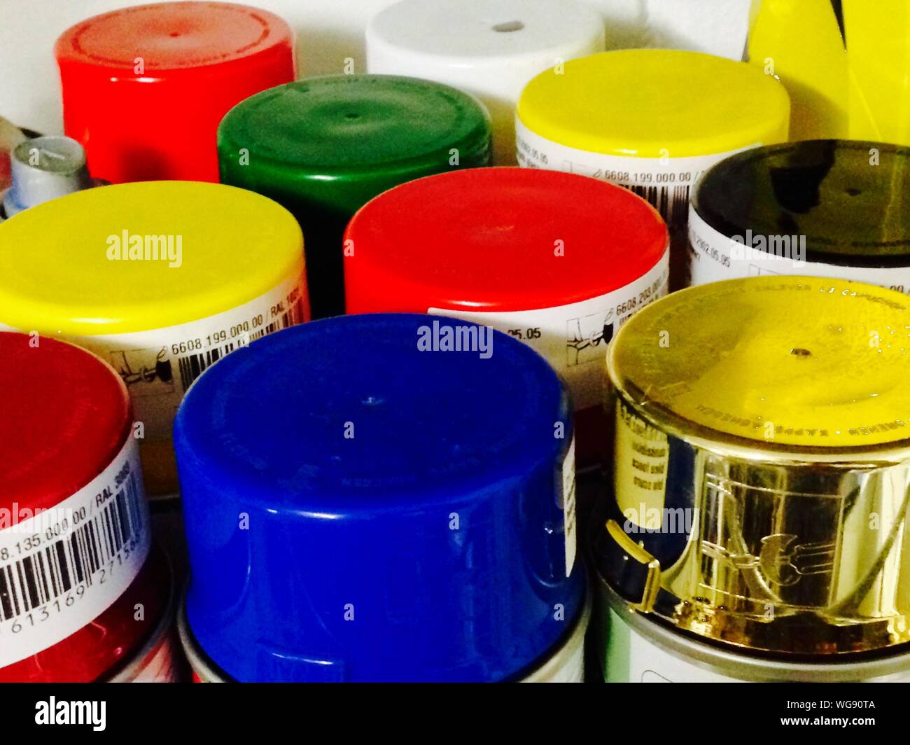 High Angle View Of Multi Colored Spray Paints Stock Photo