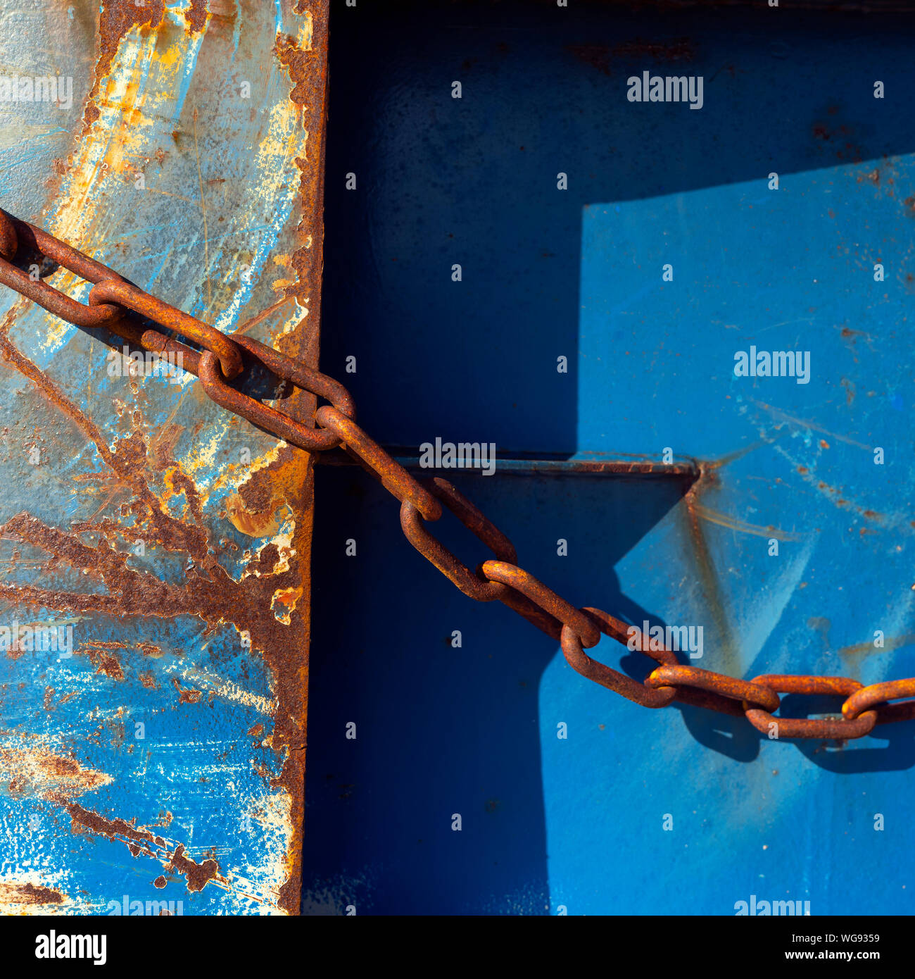 abstract blue part of rusty sheep hull and metal chain Stock Photo - Alamy
