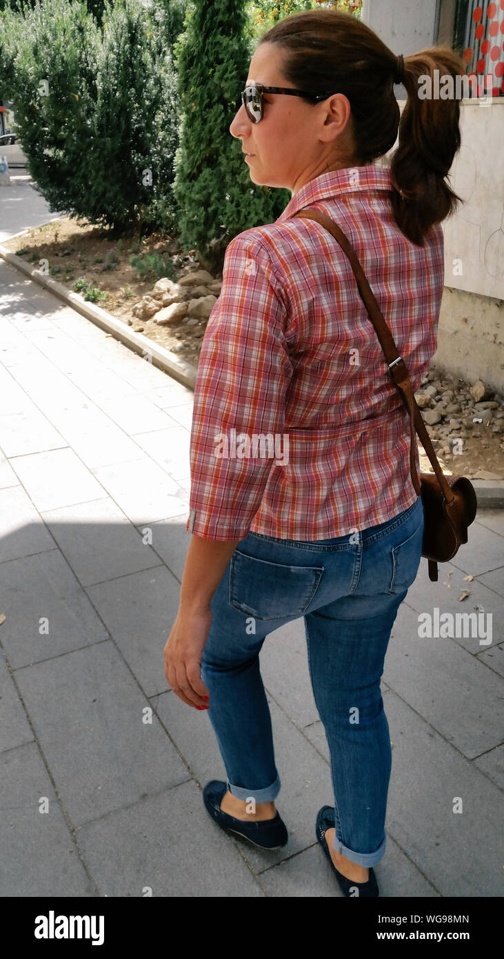 Mature woman walking outdoors hi-res stock photography and images - Alamy
