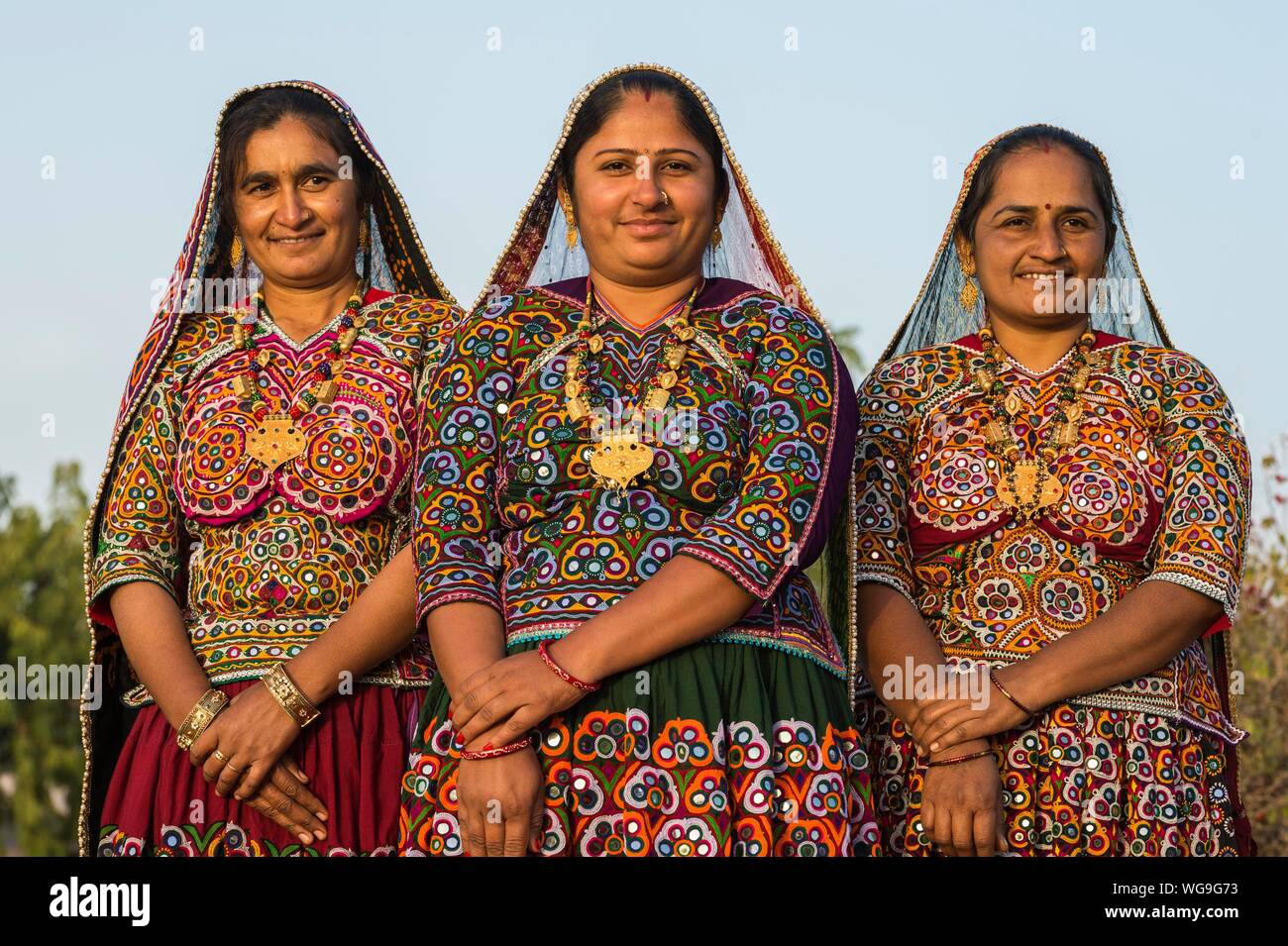 Three Ahir Women In Traditional Colorful Clothes Great Rann Of Kutch Gujarat India Stock