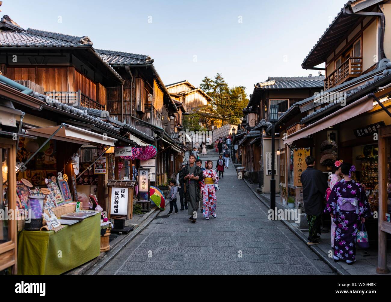 Pedestrians in an alleyway, Matsubara dori historical alleyway in the Old Town with traditional Japanese houses, Kiyomizu, Kyoto, Japan Stock Photo