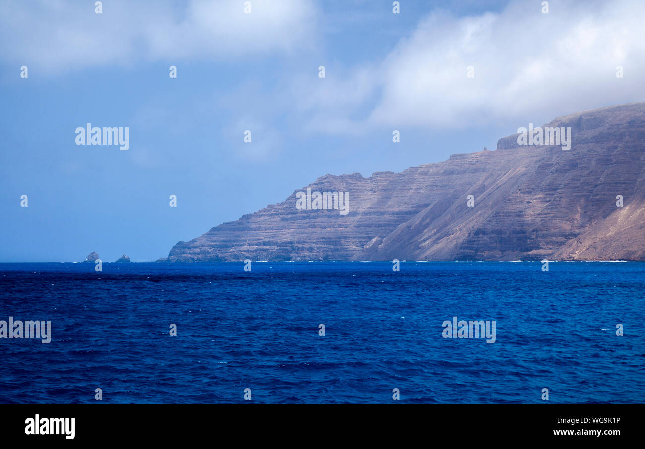 Lanzarote, Canary Islands, cape Punta de Fariones, small islet Farion de Afuera, photo taken from strait El Rio between Lanzarote and La Graciosa isla Stock Photo