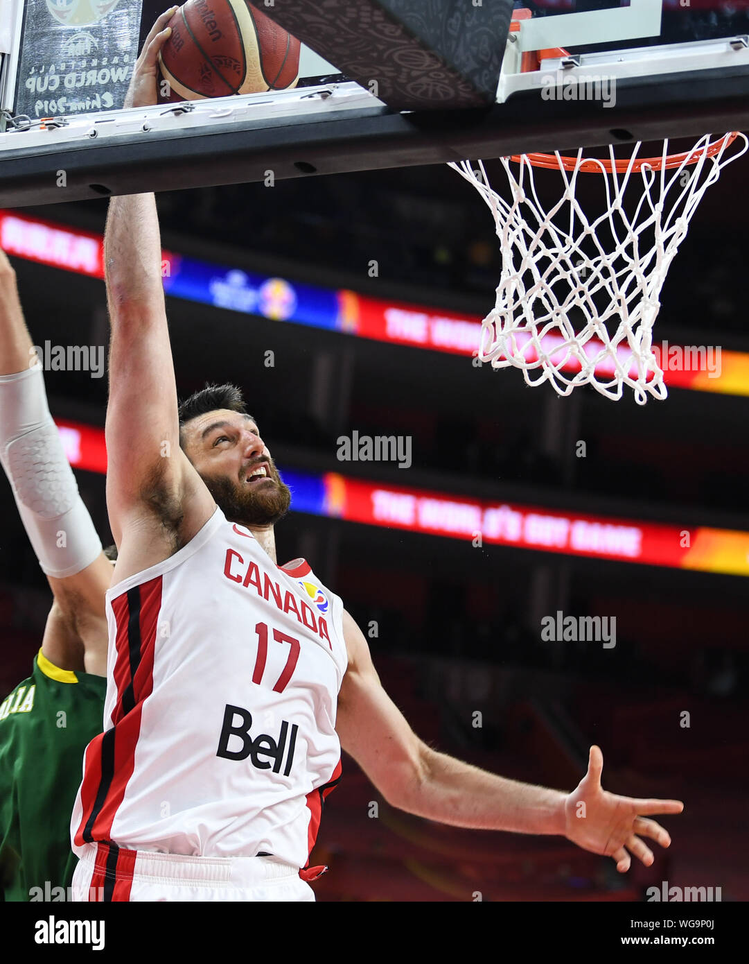 Dongguan. 1st Sep, 2019. Owen Klassen (R) of Canada goes for the basket during the group H match between Australia and Canada at the 2019 FIBA World Cup in Dongguan, south China's Guangdong Province, Sept.1, 2019. Credit: Deng Hua/Xinhua/Alamy Live News Stock Photo