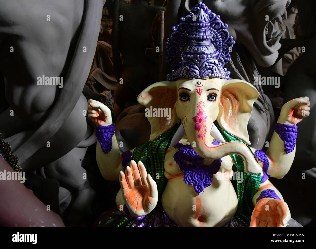 Idol of Lord Ganesha . Artisans of kumortuli , kolkata makes thousands of lord ganesha clay idols every year. Stock Photo