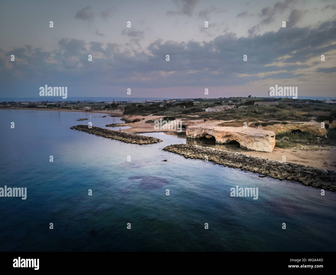 Aerial shot of the Cirica Bay at sunrise. Cirica is a beautiful nature  seaside place made of cliffs, rocks and sand in the southern Sicily, Italy  Stock Photo - Alamy