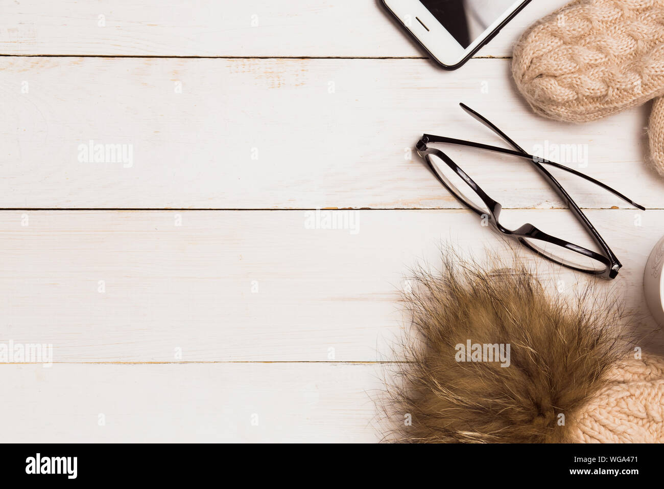 Flat Lay With Winter Warm Clothes Knitted Hat With Mittens Coffee Glasses And Smartphone On Wooden White Background With Copy Space Christmas Conc Stock Photo Alamy