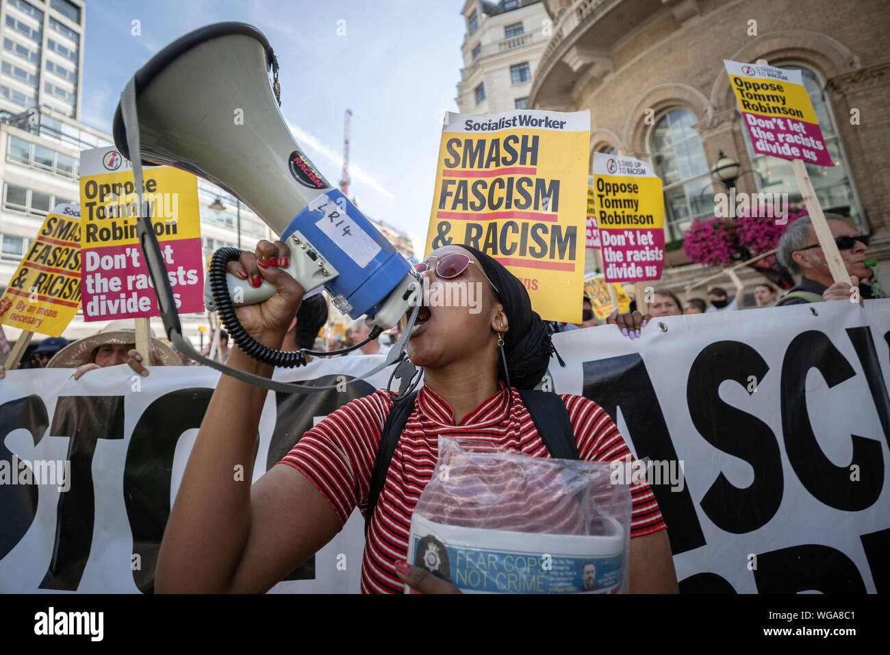 'Free Tommy Robinson' counter-protesters including antifascist activists oppose the pro-Robinson demonstrators outside BBC Broadcasting House, London. Stock Photo