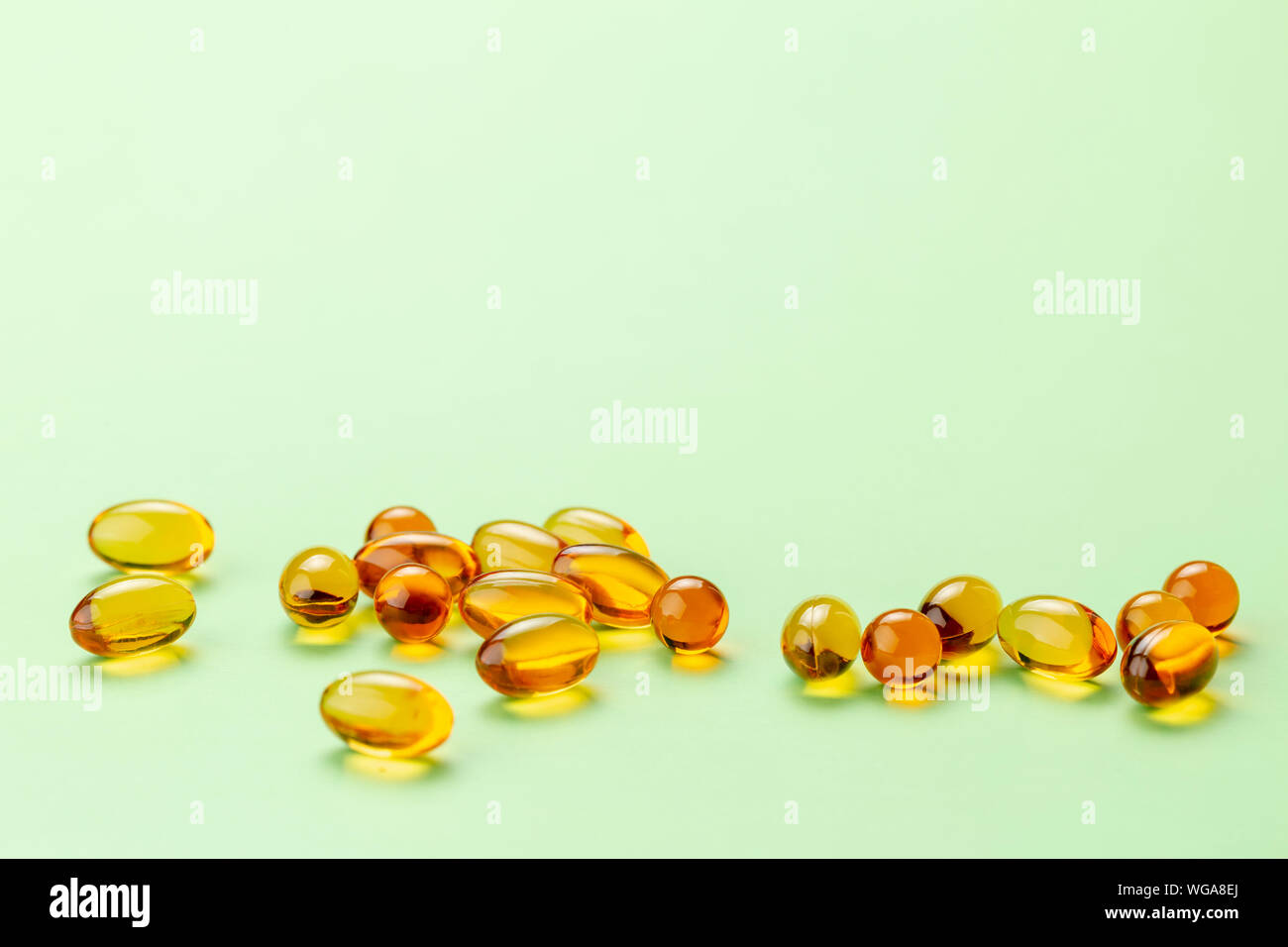 Close Up Of Vitamin D3 Omega 3 Fish Oil Capsules On Bright