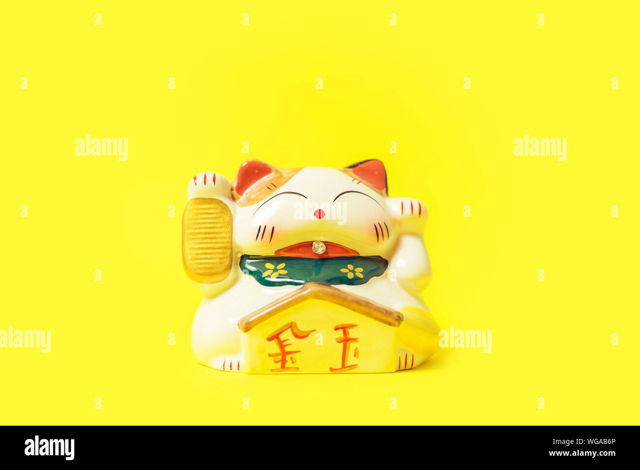 Maneki Neko Japanese lucky cat figure Stock Photo