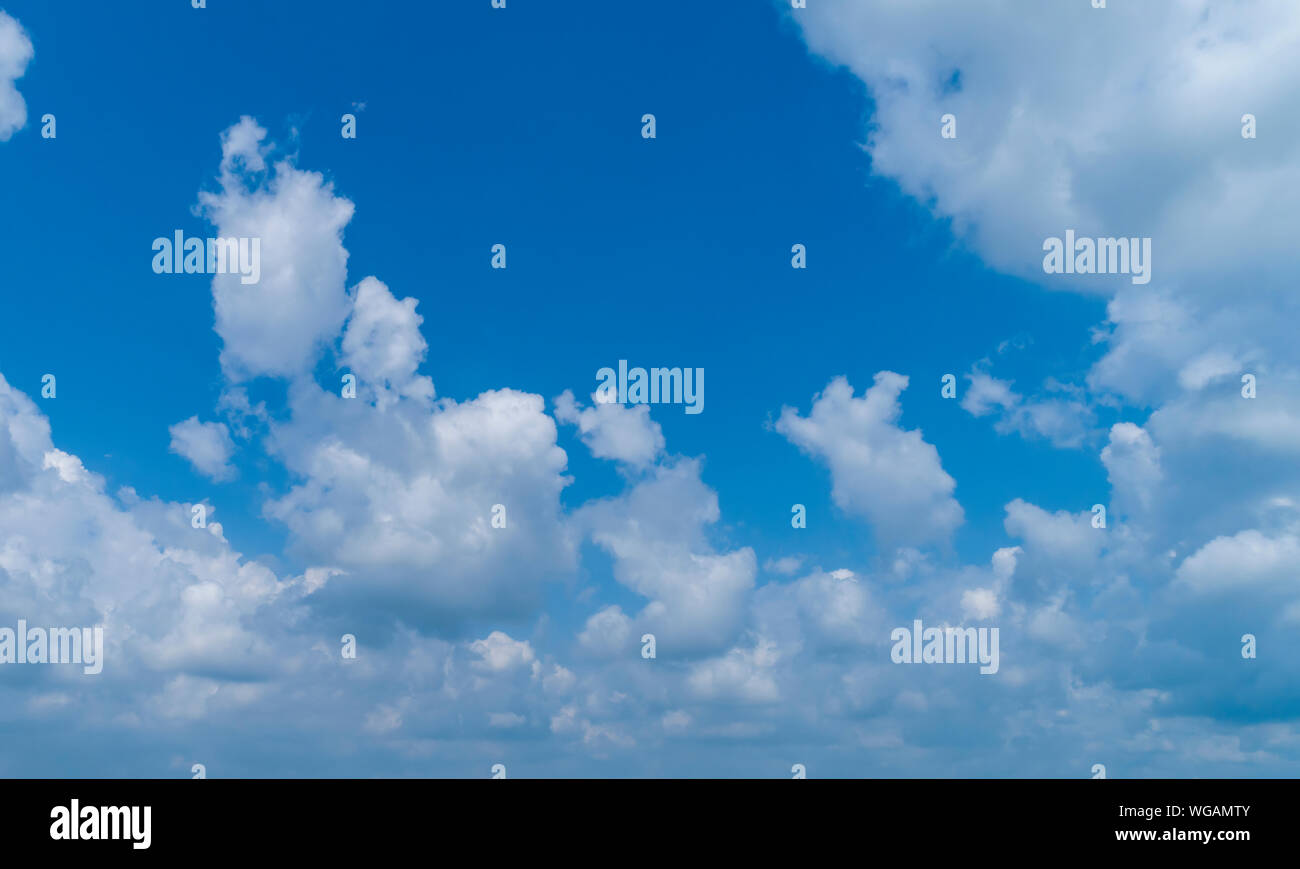 White Fluffy Clouds Floating in the Bright Blue Skies on a Summer Day ...
