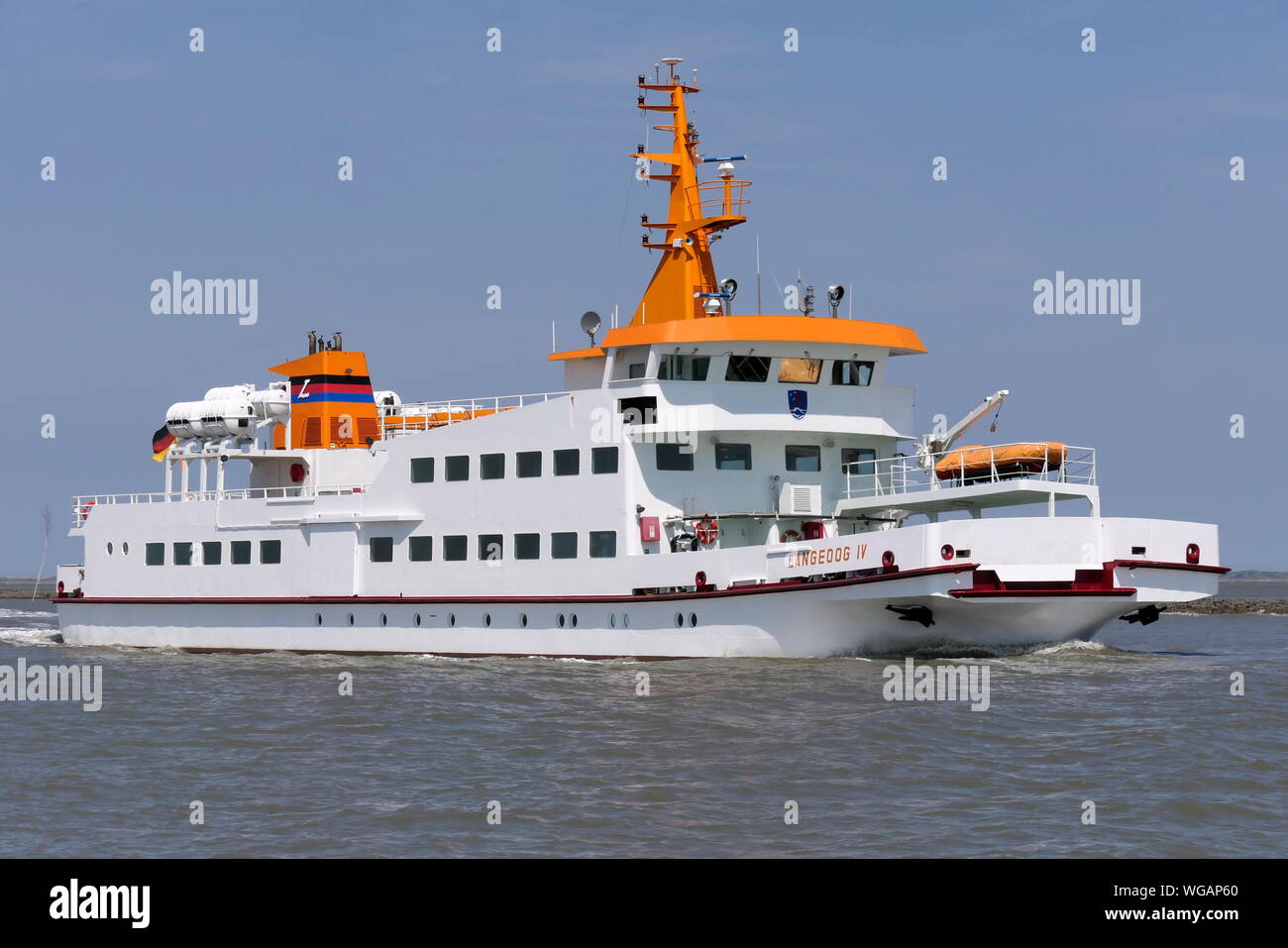 The passenger ship Langeoog IV arrives on June 23, 2019 the port of Bensersiel. Stock Photo