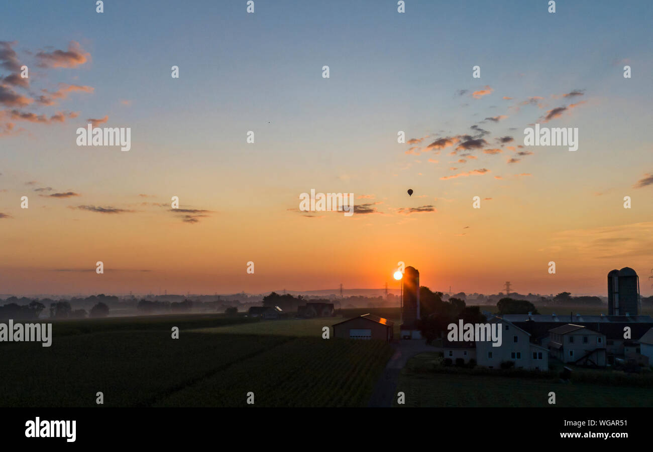 An Aerial View of a Sunrise Over an Amish Farm with Blues and Reds With ...