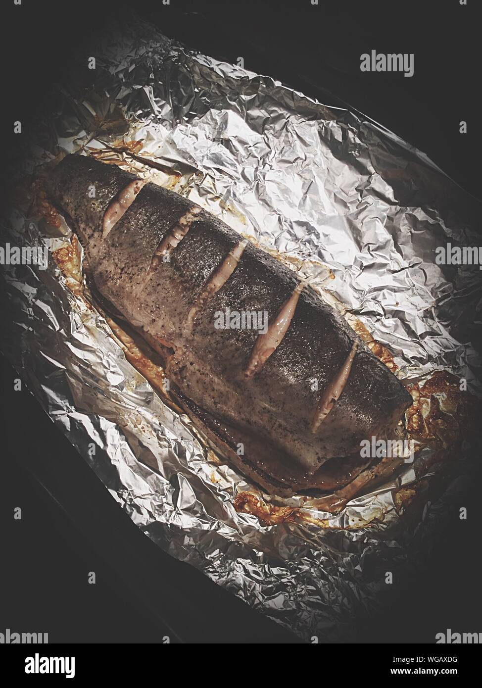 Fish wrapped in foil hi-res stock photography and images - Alamy