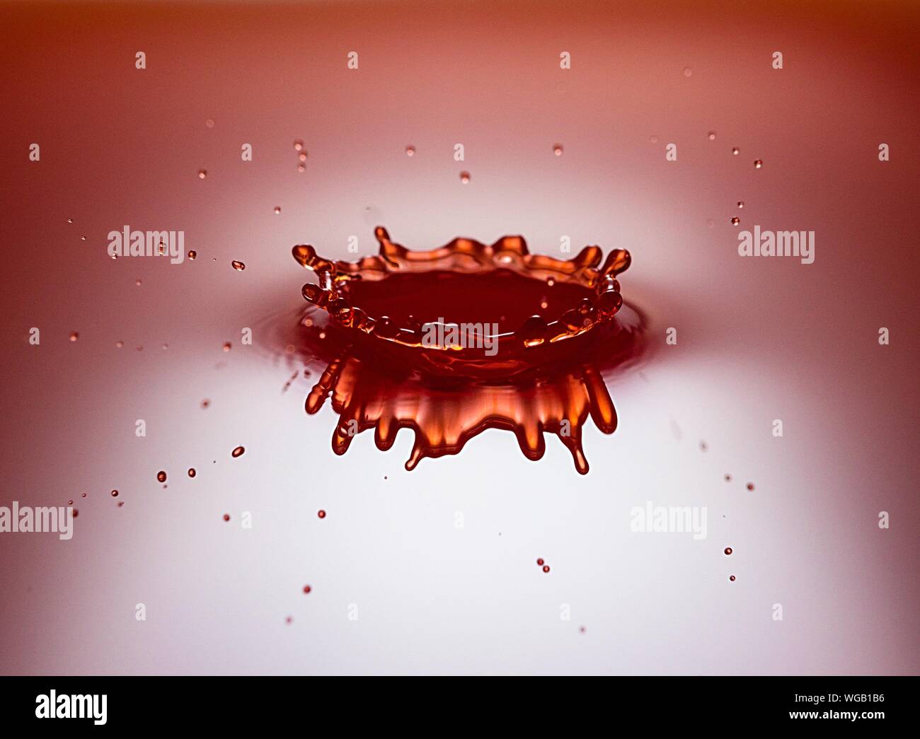 Water drop hitting water surface hires stock photography and images