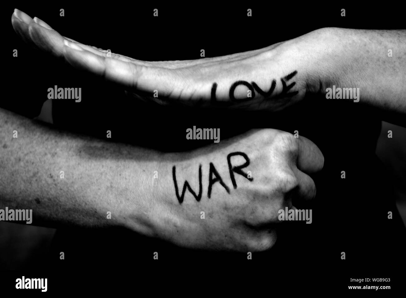 Midsection Of Woman With Love And War Text On Hands Stock Photo Alamy