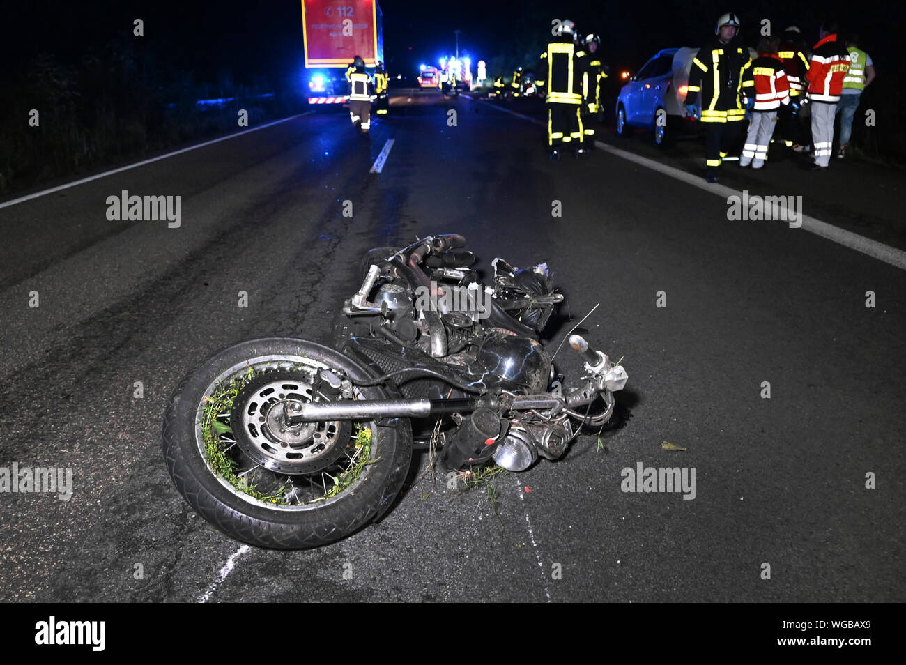 Dorsten, Germany. 03rd Aug, 2017. A motorcycle is lying on motorway 31. The accident killed a 61-year-old man and a 51-year-old woman from the Netherlands. A man had driven his car onto the motorcycle for unknown reasons, the police reported. The motorcycle was thrown over the road by the force of the impact. According to the investigation, another female driver noticed the accident too late and was no longer able to brake. Credit: Guido Bludau/dpa/Alamy Live News Stock Photo