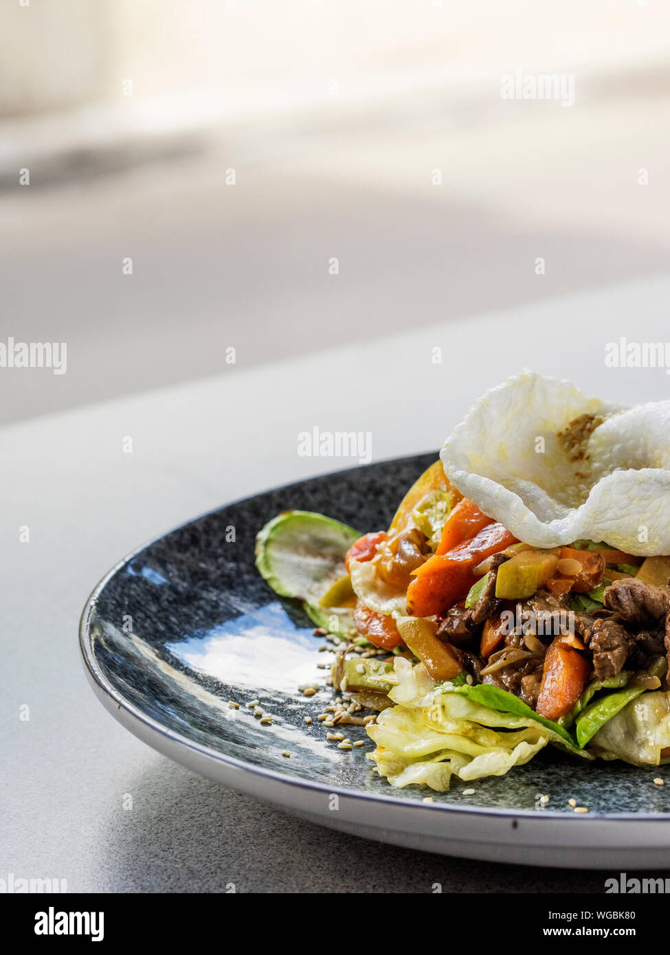 Close-up Of Fresh Salad With Chopped Steak Plate On Table Stock Photo