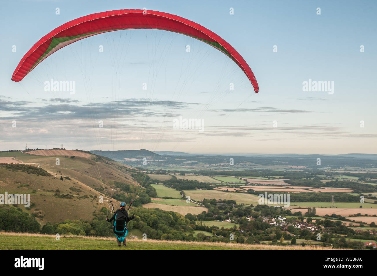 Devils Dyke, Brighton, Sussex, UK..1st September 2019..North Westerley wind brings paraglider pilots to the popular site North of Brighton in the beautiful South Downs. . Stock Photo