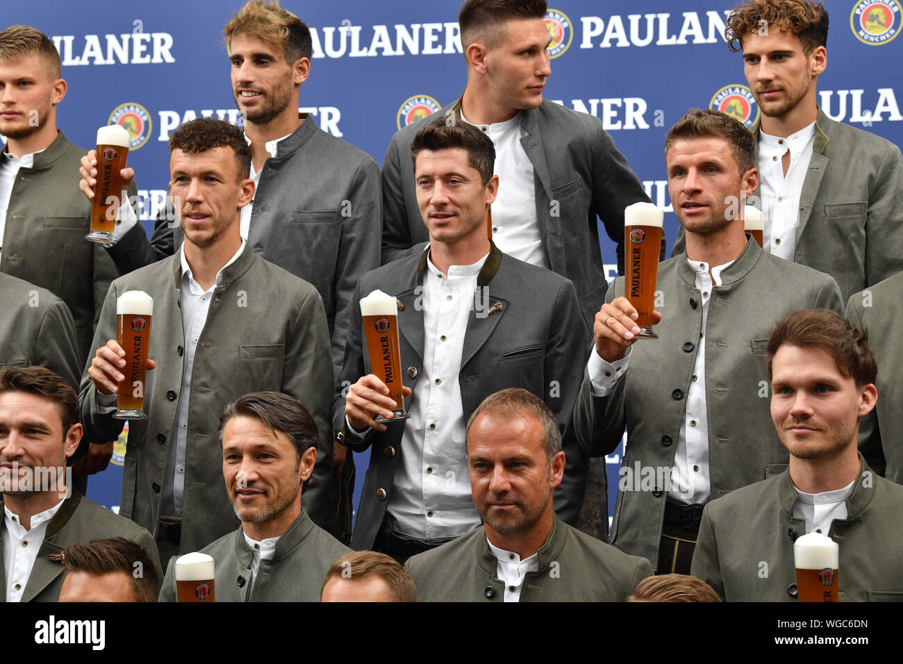 Munich, Germany. 01st Sep, 2019. Ivan Perisic (middle row, l-r), Robert  Lewandowski and Thomas Müller, all FC Bayern players, are standing in a  photo studio. The players and the coach of FC