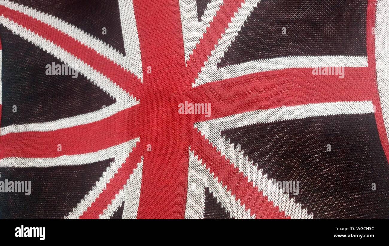Full Frame Shot Of British Flag Represented On Fabric Stock Photo