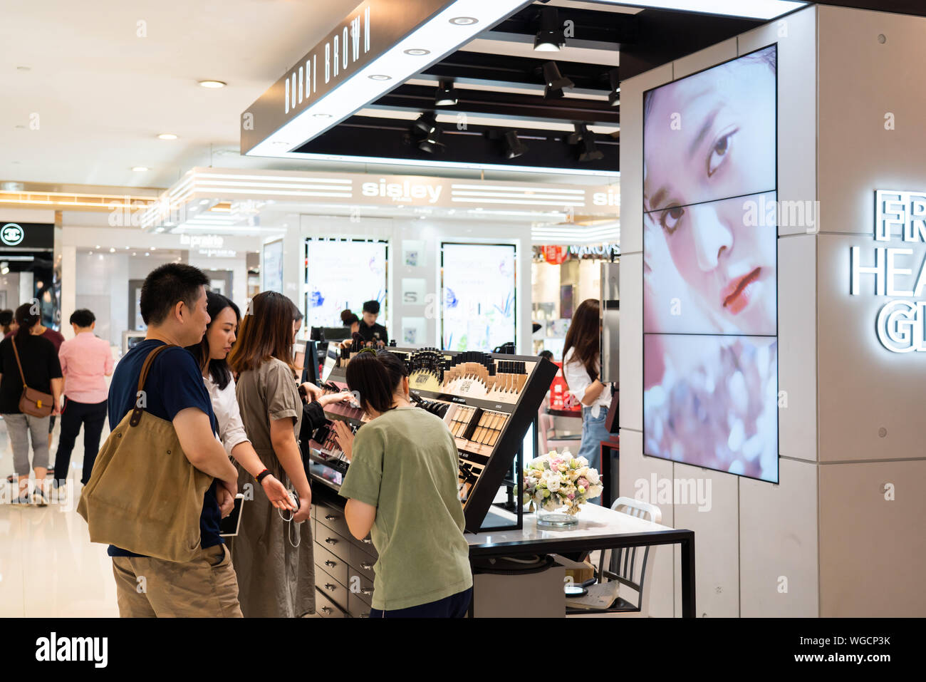 Customers shop for cosmetics at Bobbi Brown store in Shanghai. Stock Photo