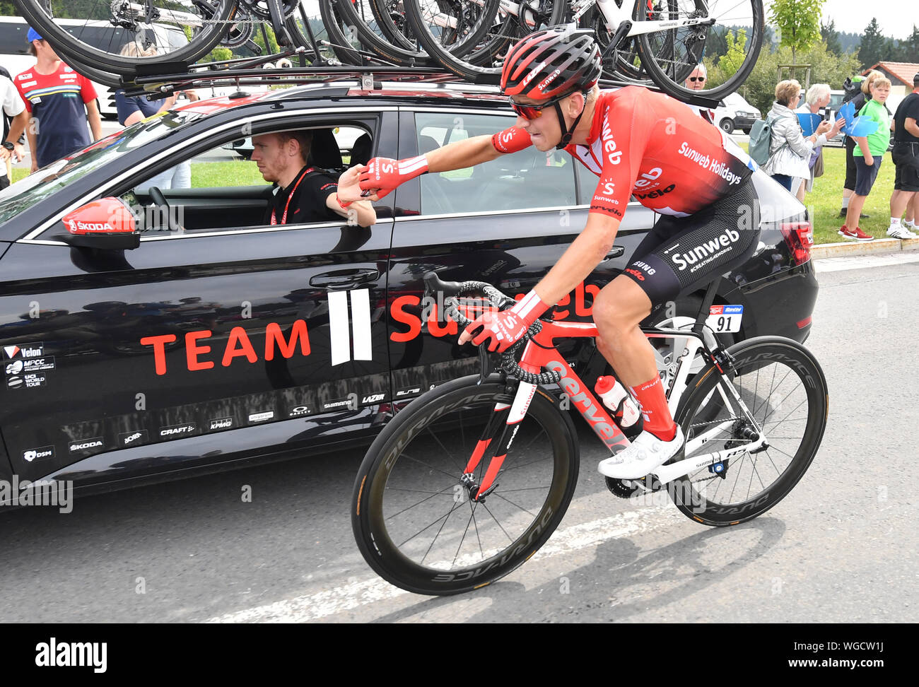 Erfurt, Germany. 01st Sep, 2019. Cycling: UCI Europaserie - Germany Tour,  Stage 4, Eisenach - Erfurt (159, 50 km). The German Lennard Kämna from Team  Sunweb drives next to the team wagon.