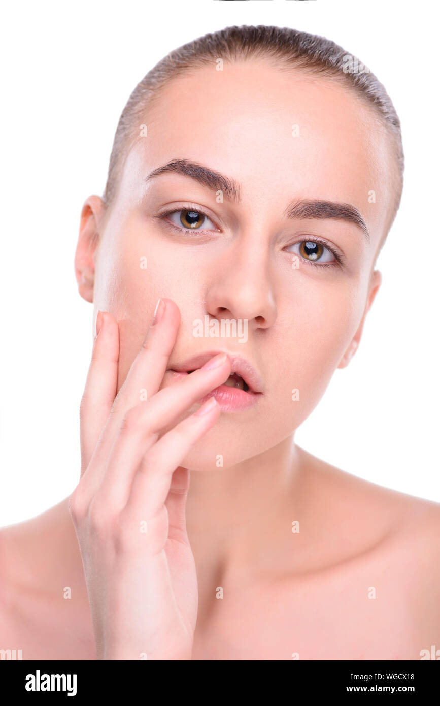 Beauty of health young woman. Girl Touching her Face. Isolate on white ...